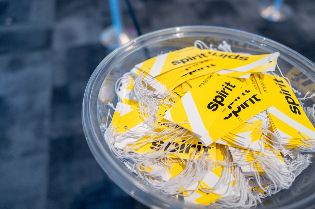 AUSTIN, TEXAS - APRIL 10: Spirit Airlines baggage tags are seen near a check-in desk at Austin-Bergstrom International Airport on April 10, 2024 in Austin, Texas.  Spirit Airlines has reported that it will delay aircraft purchases and lay off pilots as the company continues to struggle with financial difficulties.  The move comes after a federal judge blocked a proposed deal that would have allowed the airline to be acquired by JetBlue.